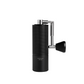 Black coffee grinder with metallic handle on a white background