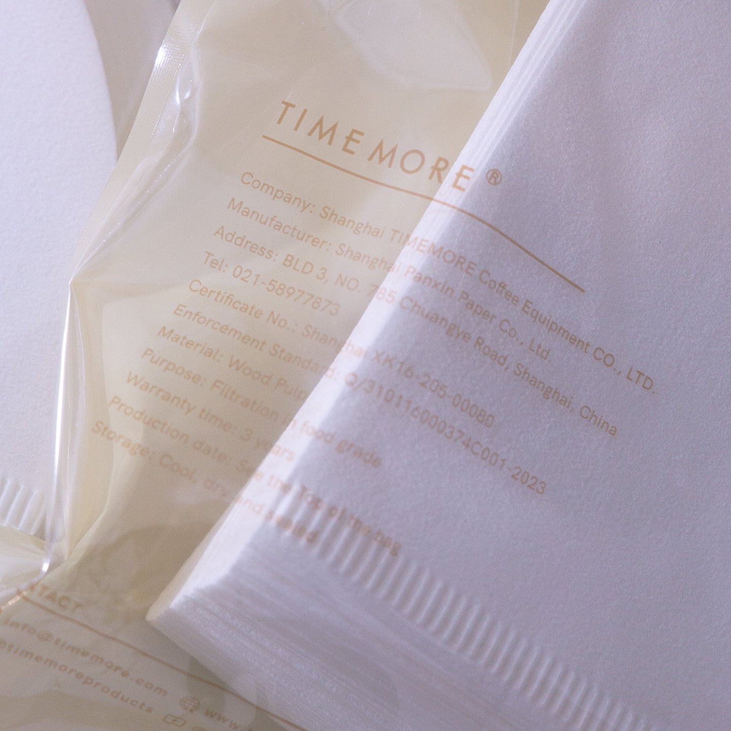 Close-up of Time More coffee paper filters with branding details.