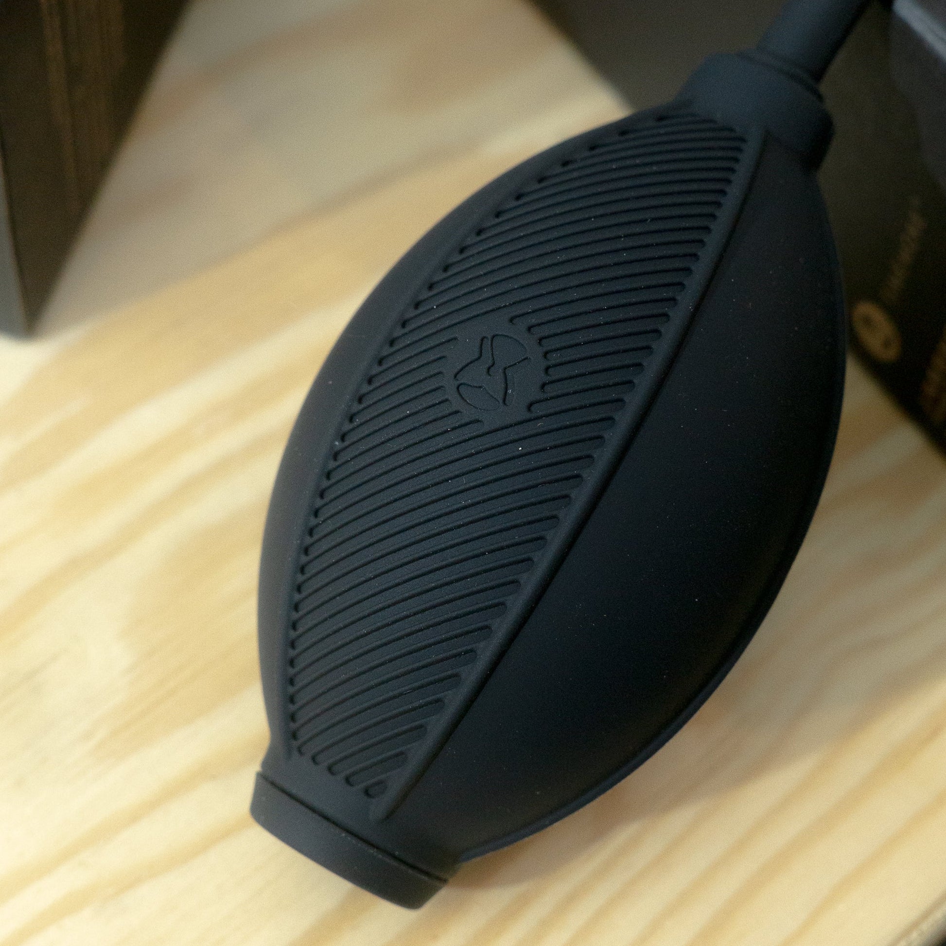 Black air blower on a wooden surface